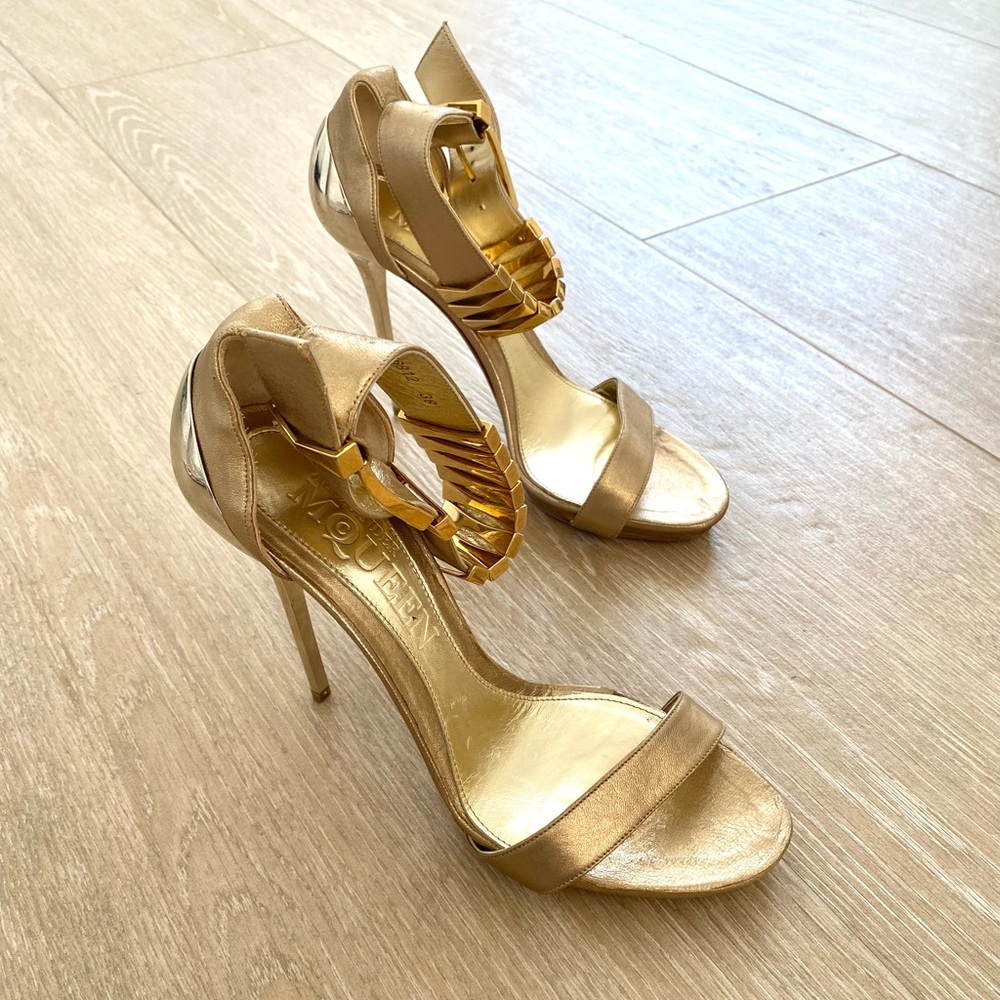 Alexander McQueen ankle strap gold metallic high heel sandals.